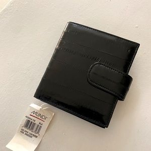Black eel skin wallet.  Has pockets for coin and dollar bills.  New, never used.